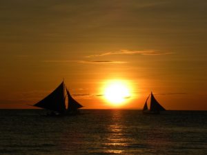 sunset over the sea ship